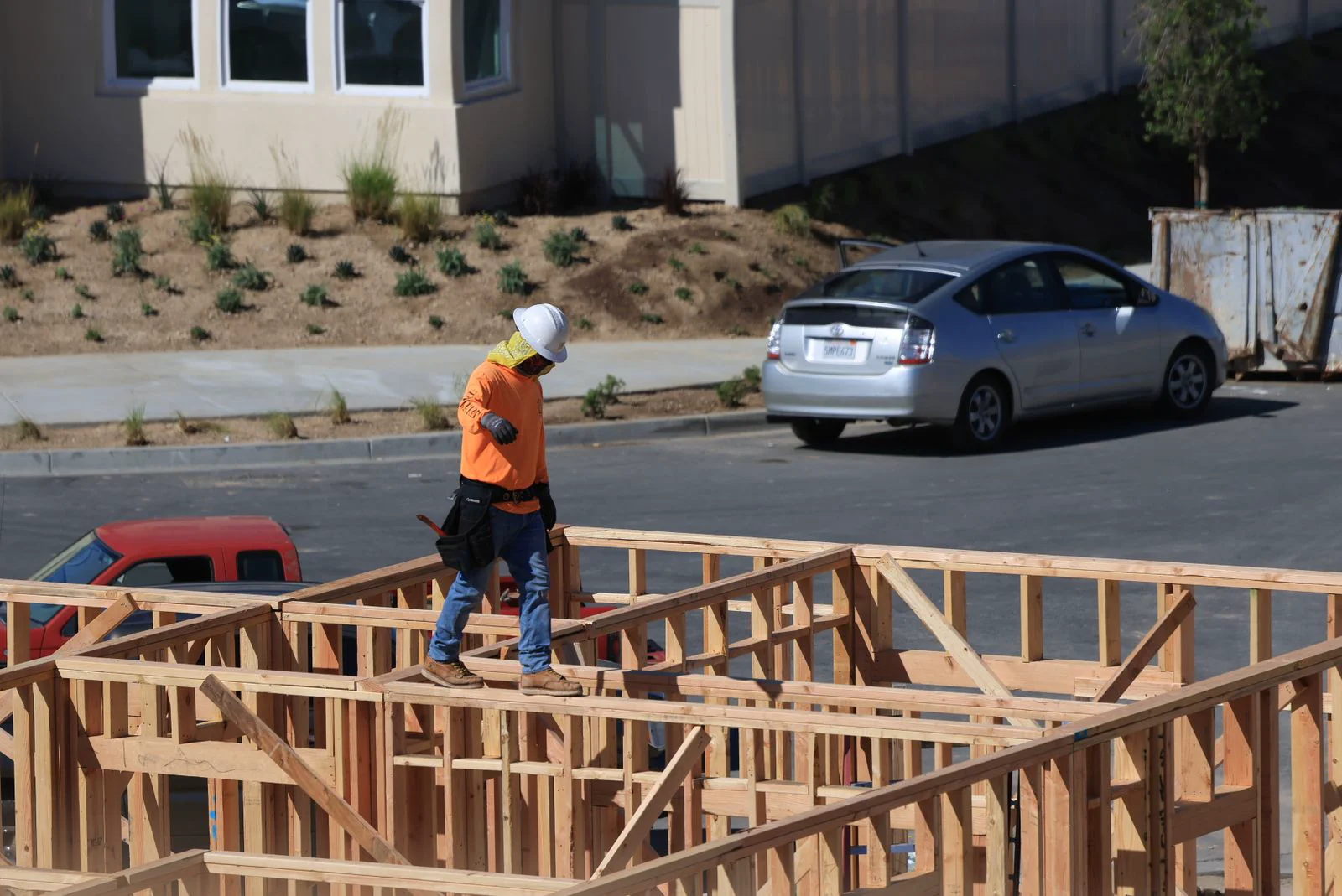 Worker on the timber frame of a residential home under construction